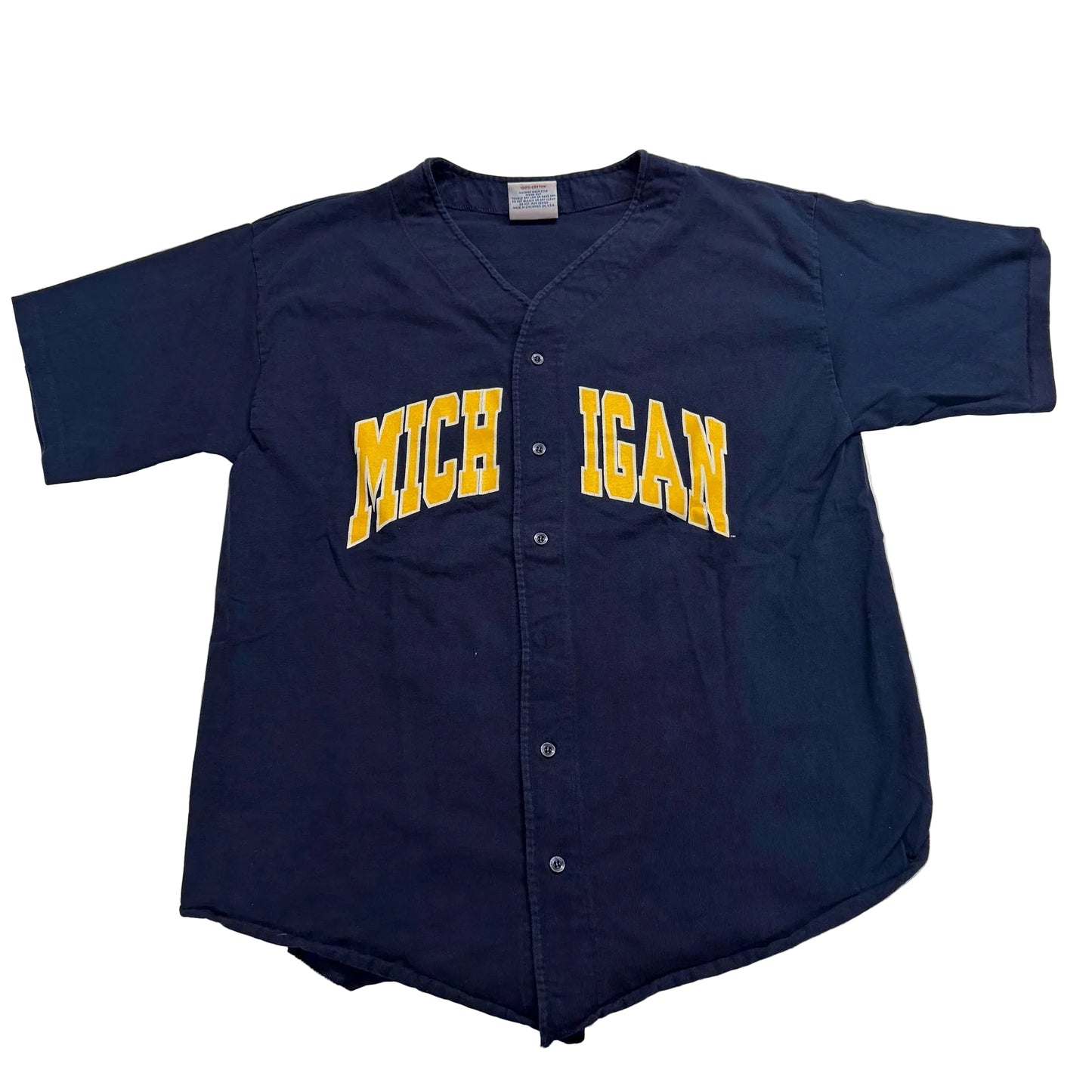 Navy blue baseball jersey with 'Michigan' printed on it, laid flat on a white surface.