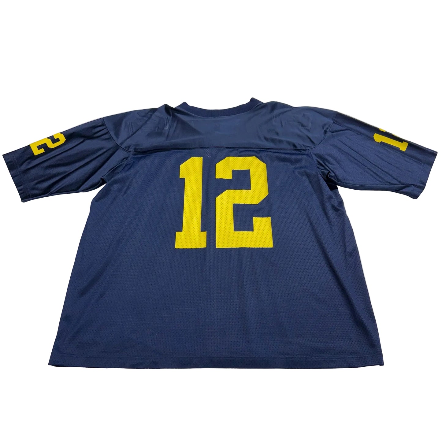 Blue sports jersey with yellow number 12 on a white surface