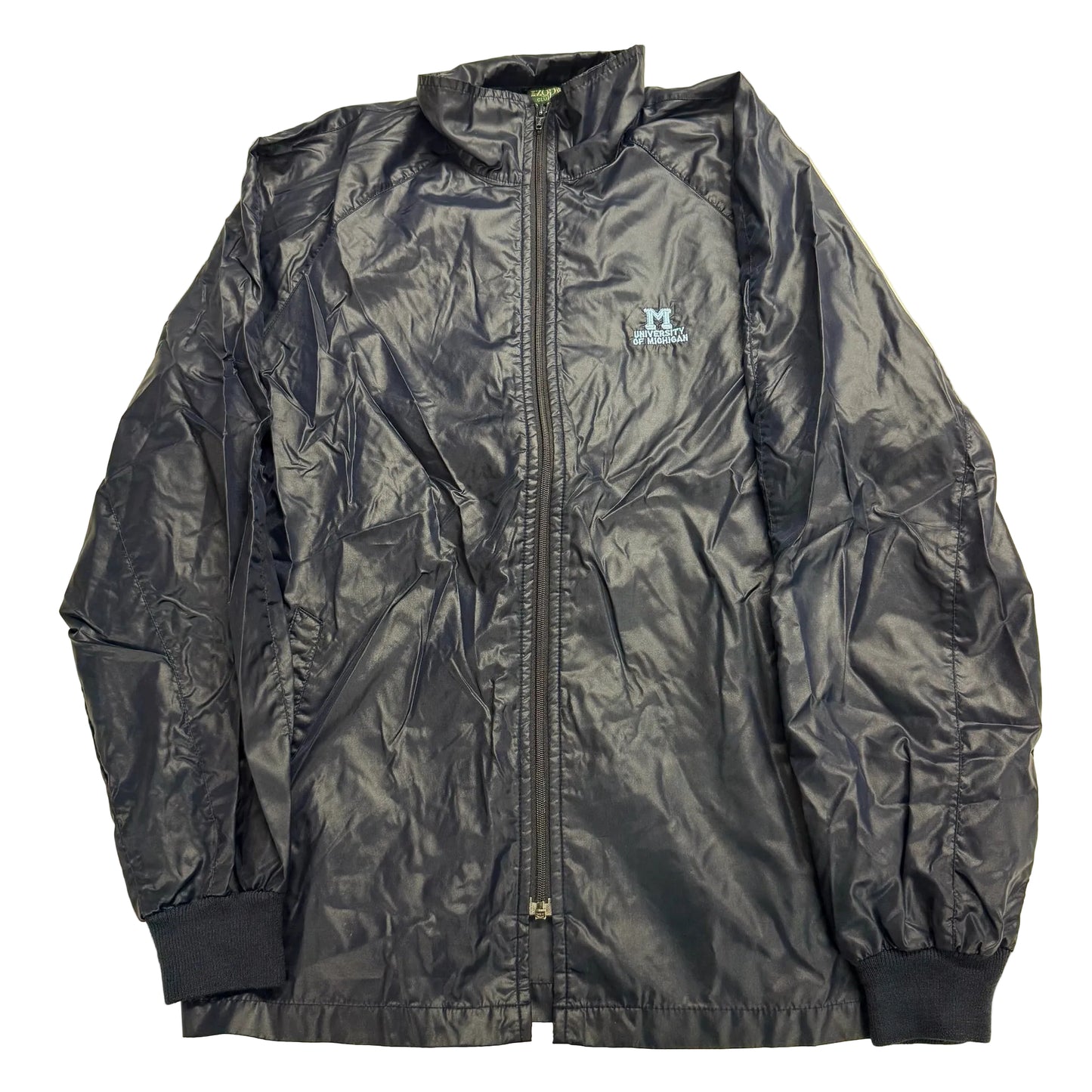 Black jacket with a brand logo on a beige background