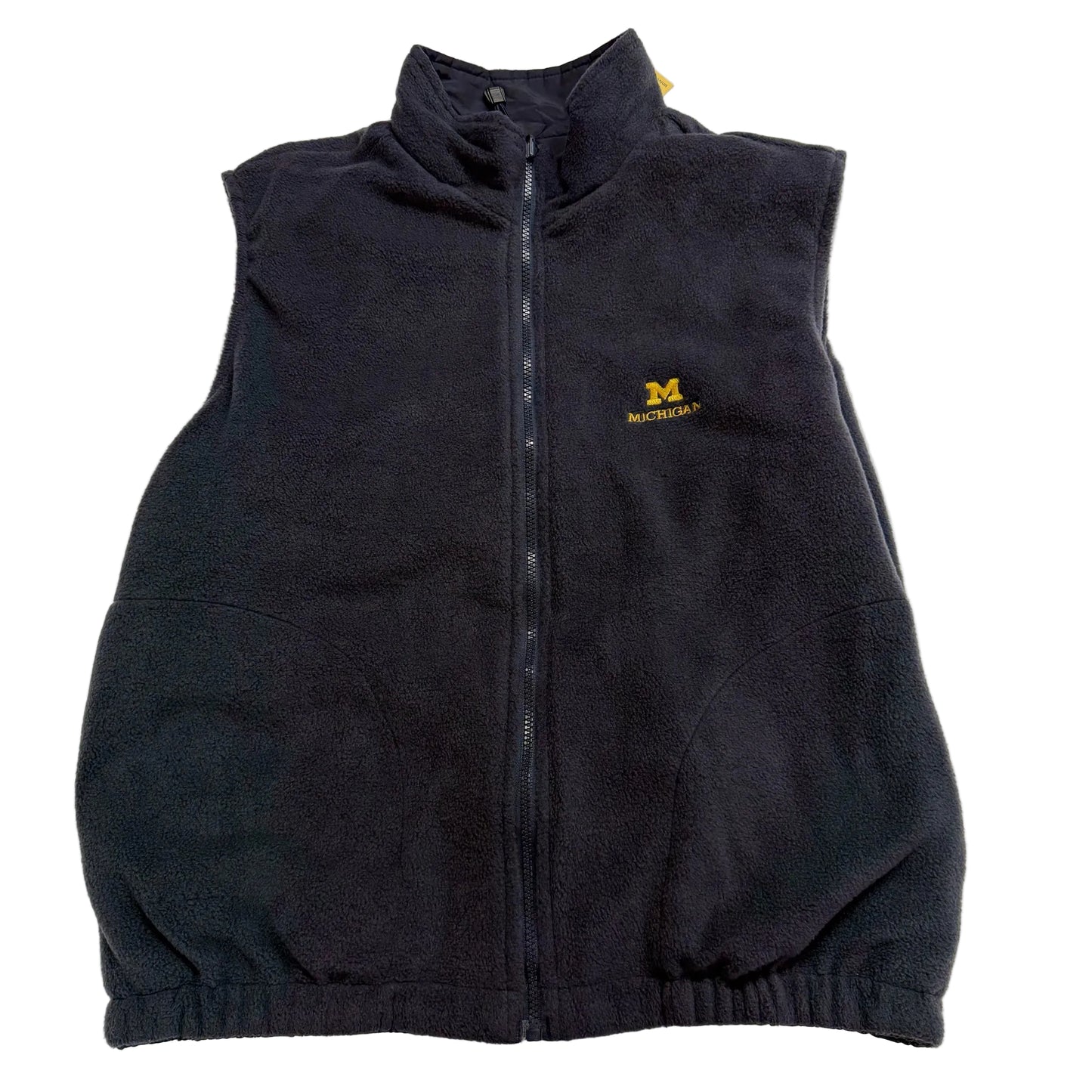 Black fleece vest with a logo on a light gray background