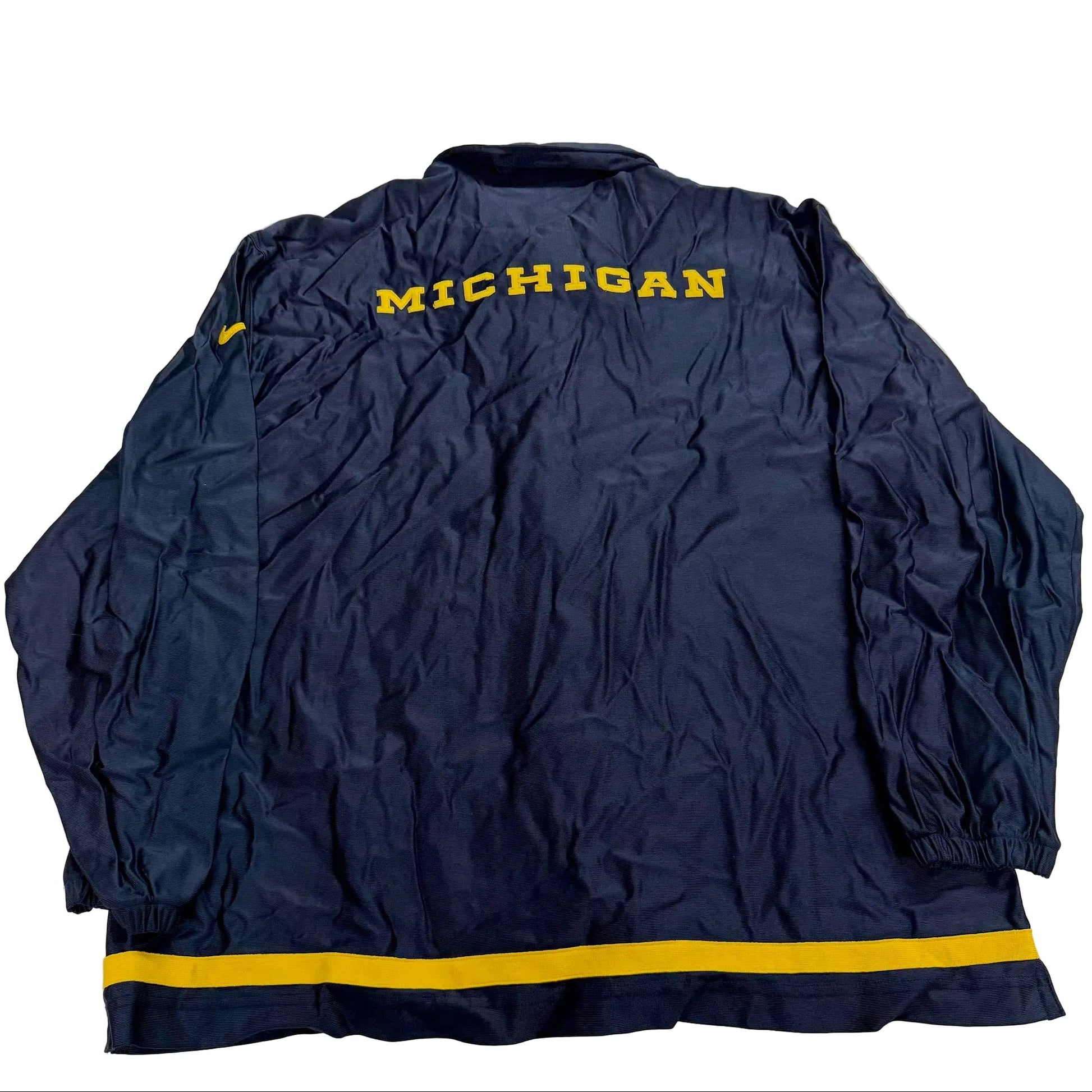 Navy blue jacket with 'MICHIGAN' text on a light gray background