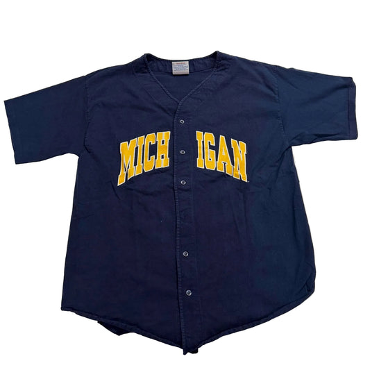 Navy blue baseball jersey with 'Michigan' printed on it, laid flat on a white surface.