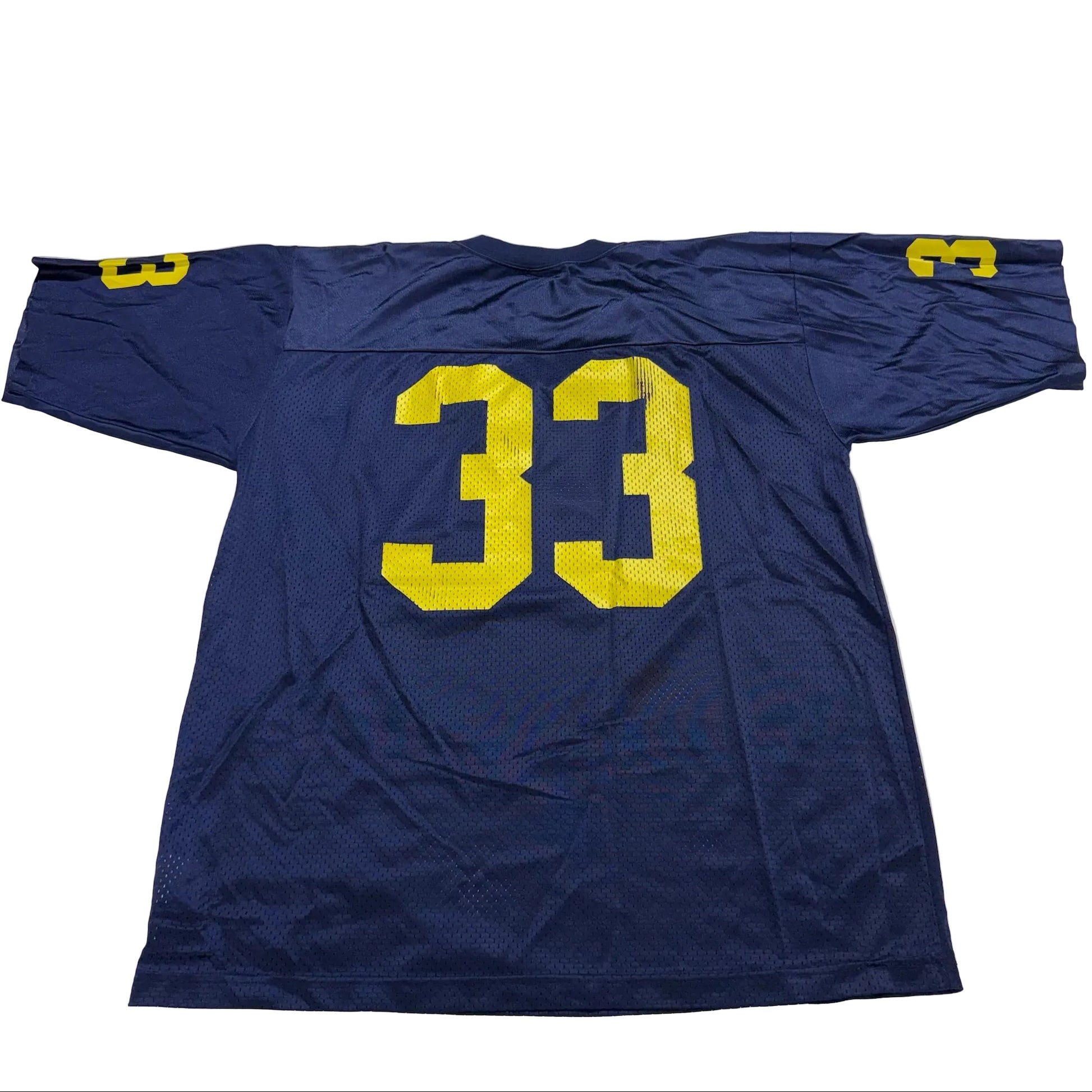 Blue sports jersey with yellow number 33 on a white surface