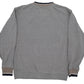 Back of a University of Michigan gray crewneck sweater, featuring beige ribbed trim at the collar and cuffs with dark navy stripes.