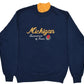 University of Michigan navy blue crewneck sweatshirt with a yellow mock neck collar, featuring 'Michigan Tournament of Roses' printed in yellow and white on the chest with a rose graphic.