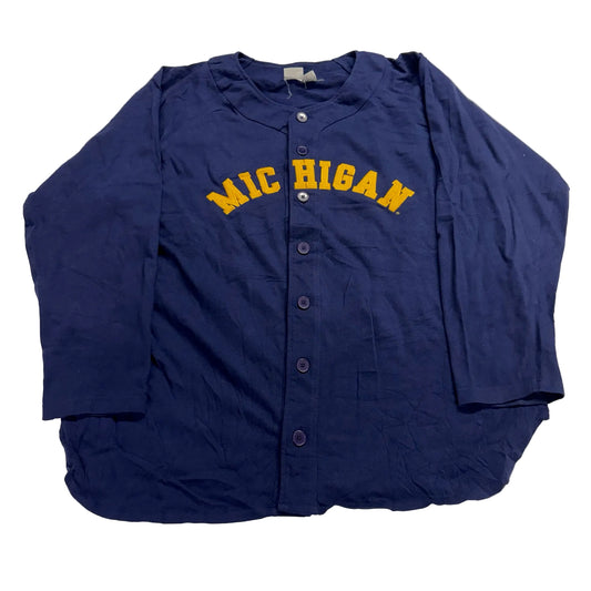 Blue baseball jersey with 'Michigan' printed on it, laid flat on a white surface.