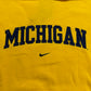 Yellow sweatshirt with 'MICHIGAN' text and Nike logo