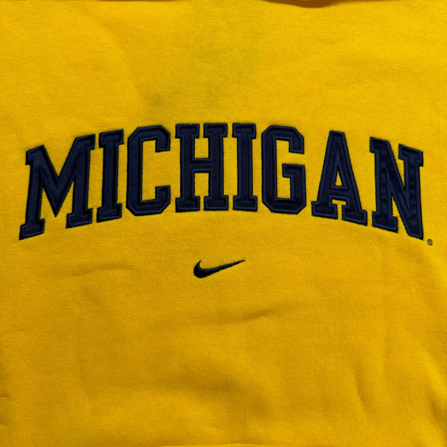 Yellow sweatshirt with 'MICHIGAN' text and Nike logo