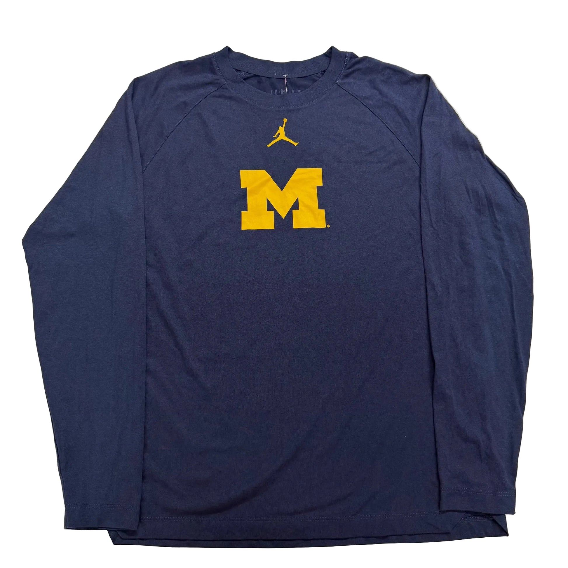 Navy long-sleeve shirt with yellow 'M' logo on a white background
