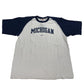 White and navy baseball shirt with 'Michigan' text on a white background