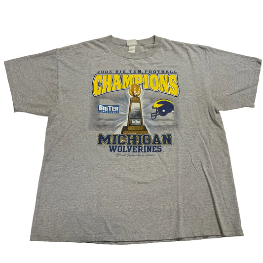 Gray t-shirt with Michigan Wolverines football championship design on a white background