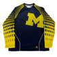 Navy athletic shirt with yellow 'M' logo and Adidas branding on a white background