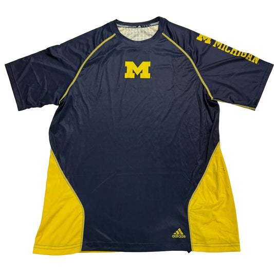 Navy and yellow athletic shirt with Michigan logo on a white background