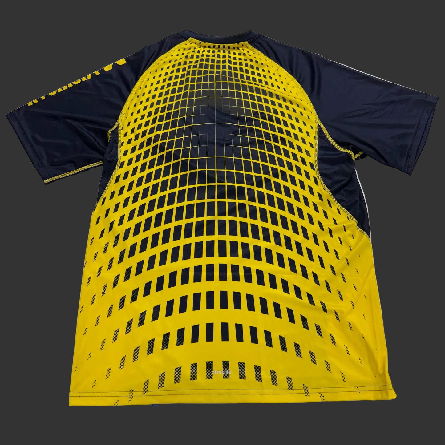 Yellow and navy sports jersey with grid pattern on a white background