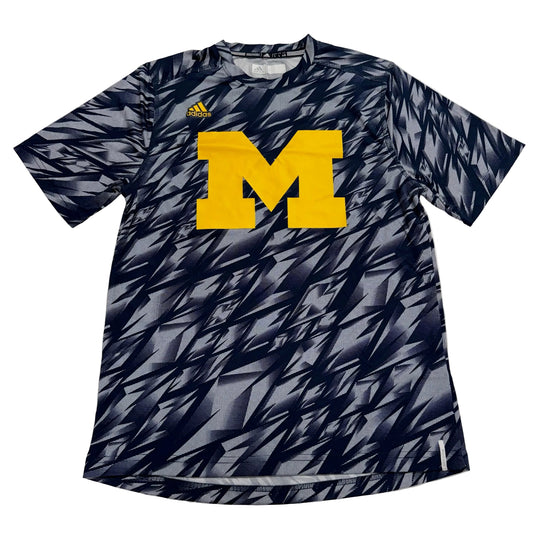 Navy athletic shirt with yellow 'M' logo and Adidas branding on a white background