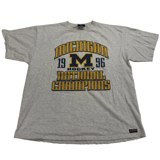 Gray t-shirt with Michigan hockey national champions text on a white background