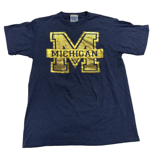 Navy blue t-shirt with gold 'Michigan' logo on a white background