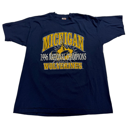 Navy blue t-shirt with 'Michigan Wolverines 1996 National Champions' text on a white background