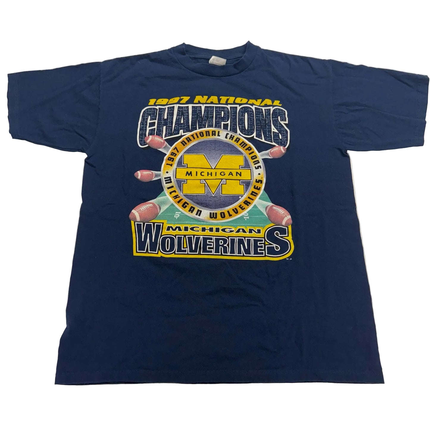 Navy blue t-shirt with '1987 National Champions Michigan Wolverines' graphic on a white background