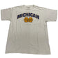 White t-shirt with 'Michigan' printed on it against a white background