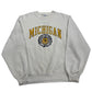 Gray sweatshirt with 'Michigan' text and logo on a white surface