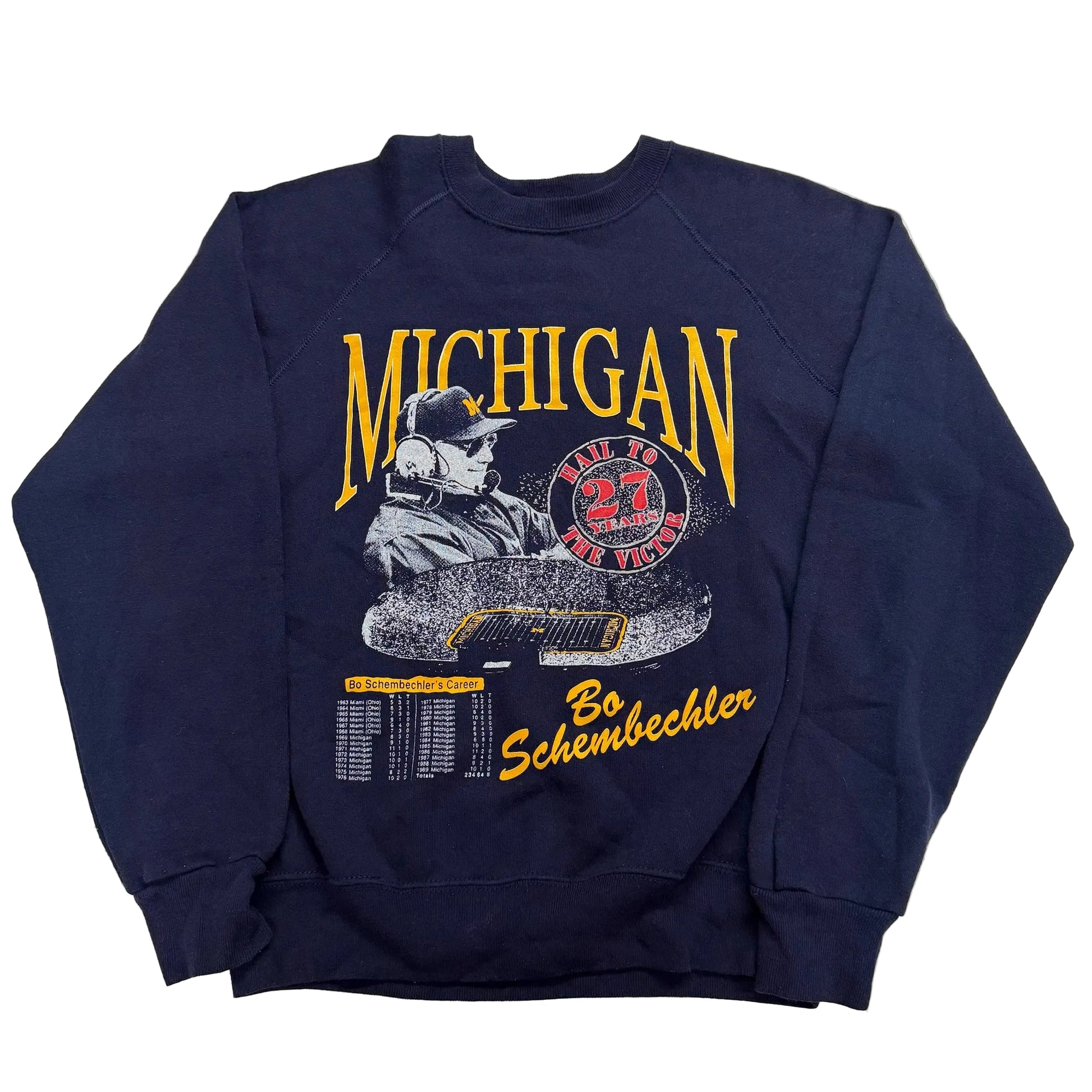Navy blue sweatshirt with 'Michigan' and a graphic of a hockey player on a white background