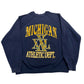 Navy blue sweatshirt with 'Michigan Athletic Dept.' text on a white background