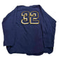 Blue sports jersey with number 32 on a white background