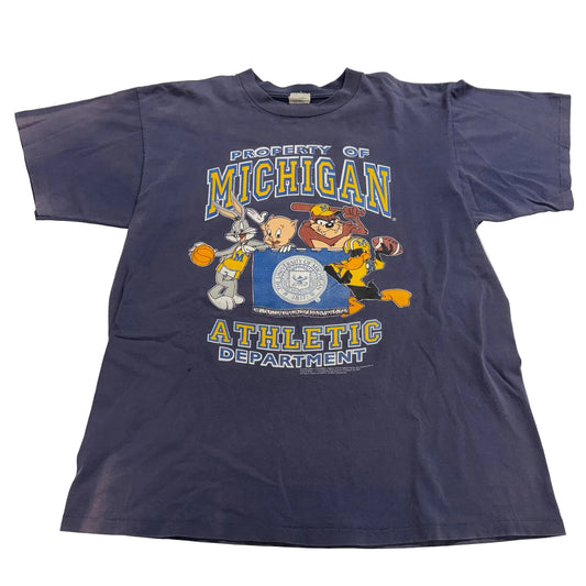 Navy blue t-shirt with cartoon characters and 'Property of Michigan Athletic Department' text on a white background