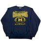 Navy blue sweatshirt with '1997 National Champions Michigan' text and logo on a white background