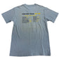 Blue t-shirt with 'Winter Tour 2023' text on a light background