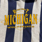 Striped shirt with 'Retro Sport Michigan Wolverines' text on a blue and gray background