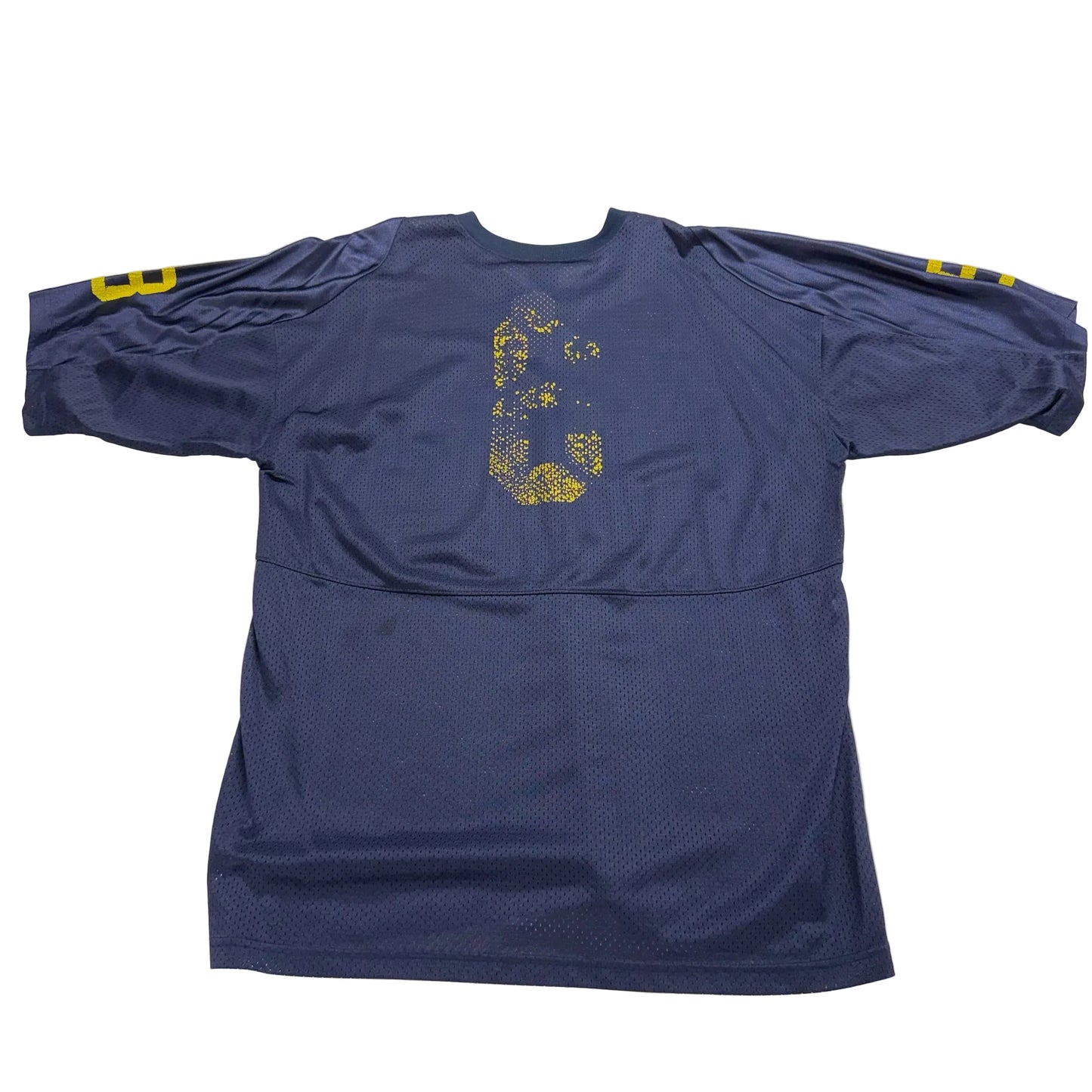 Blue athletic shirt with yellow accents on a white surface