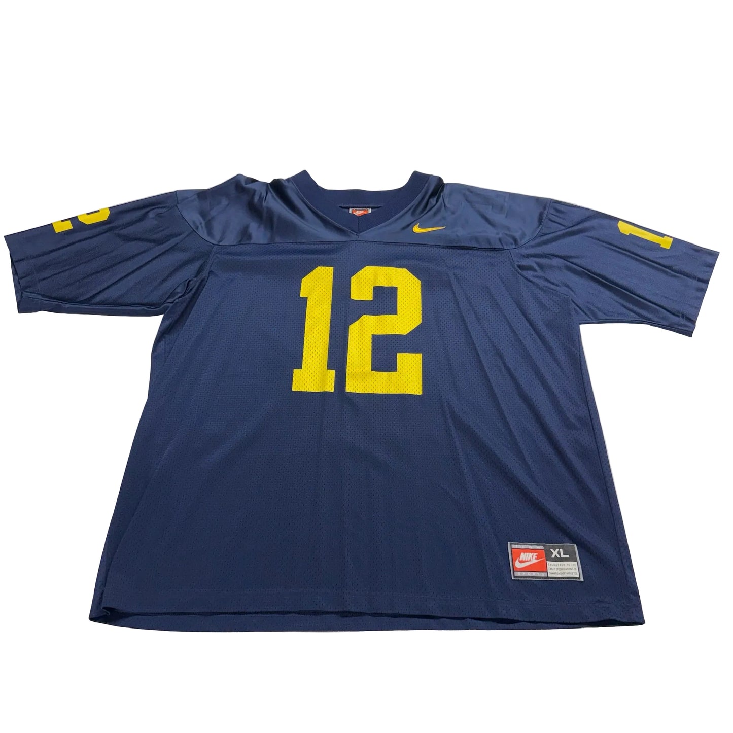 Blue sports jersey with yellow number 12 on a white table