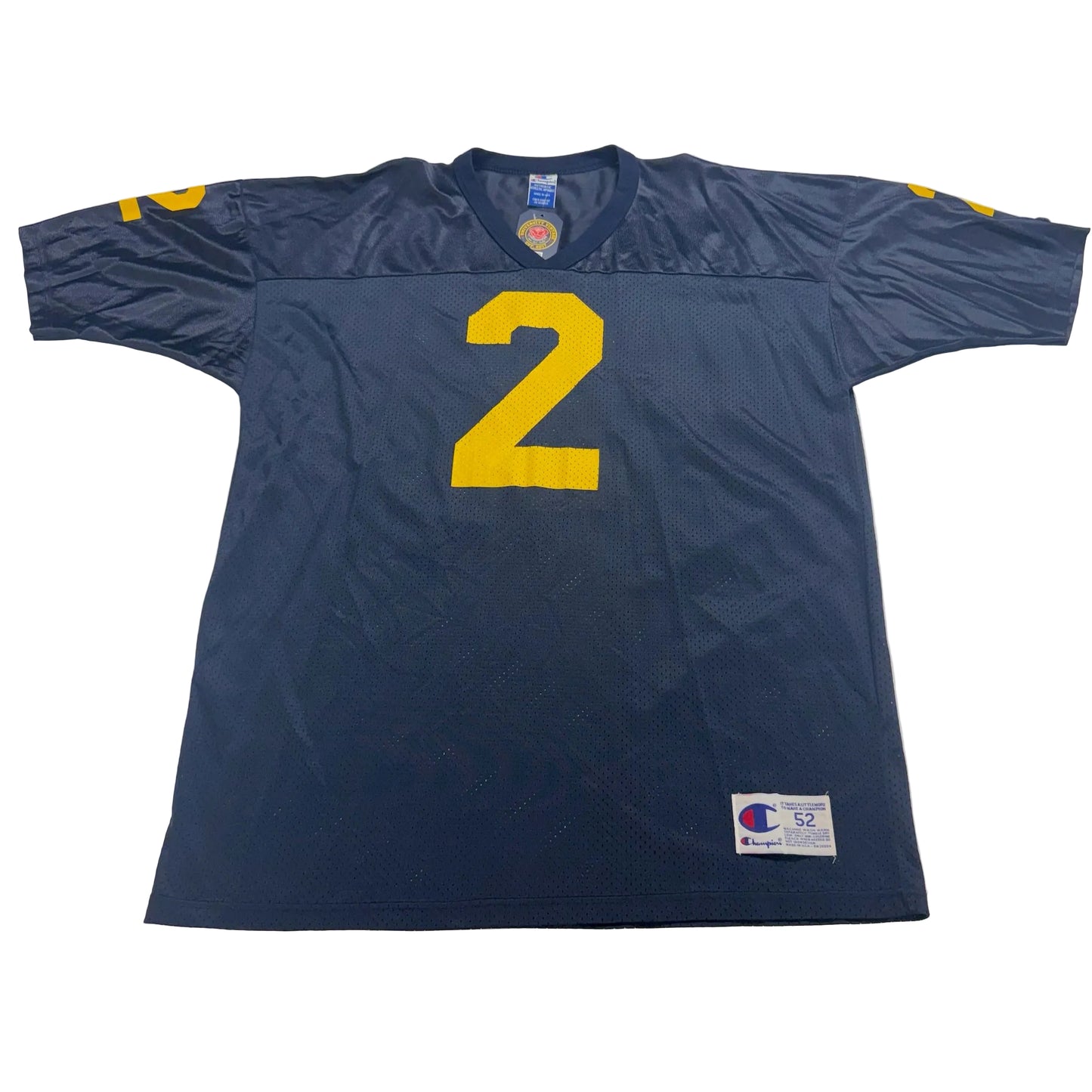 Blue sports jersey with yellow number 2 on a white surface