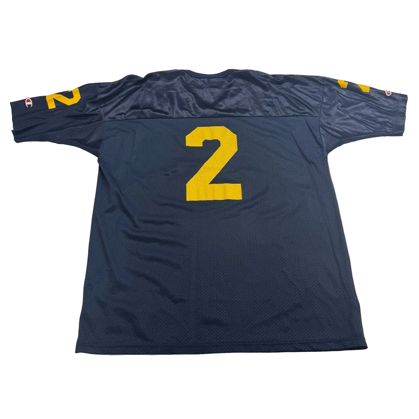 Blue sports jersey with yellow number 2 on a white surface