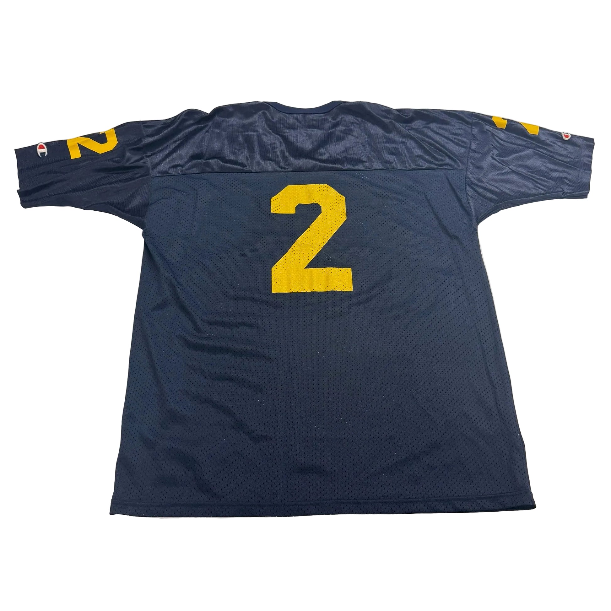 Blue sports jersey with yellow number 2 on a white surface