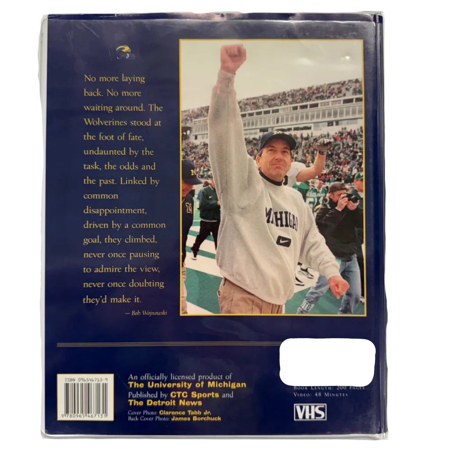 VHS tape cover with a person in a Michigan sweatshirt on a sports field, text, and VHS logo.