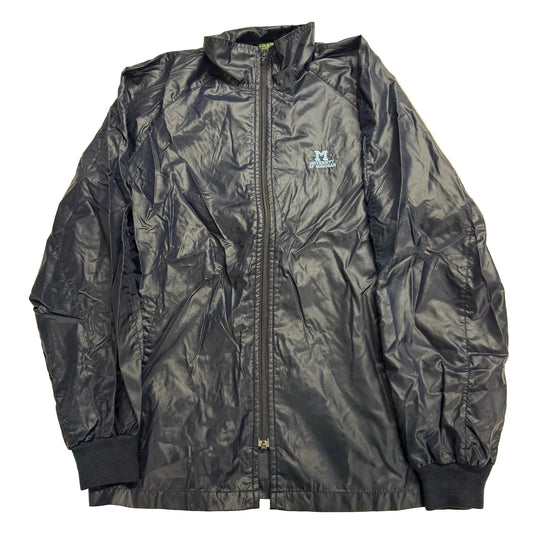 Black jacket with a brand logo on a beige background
