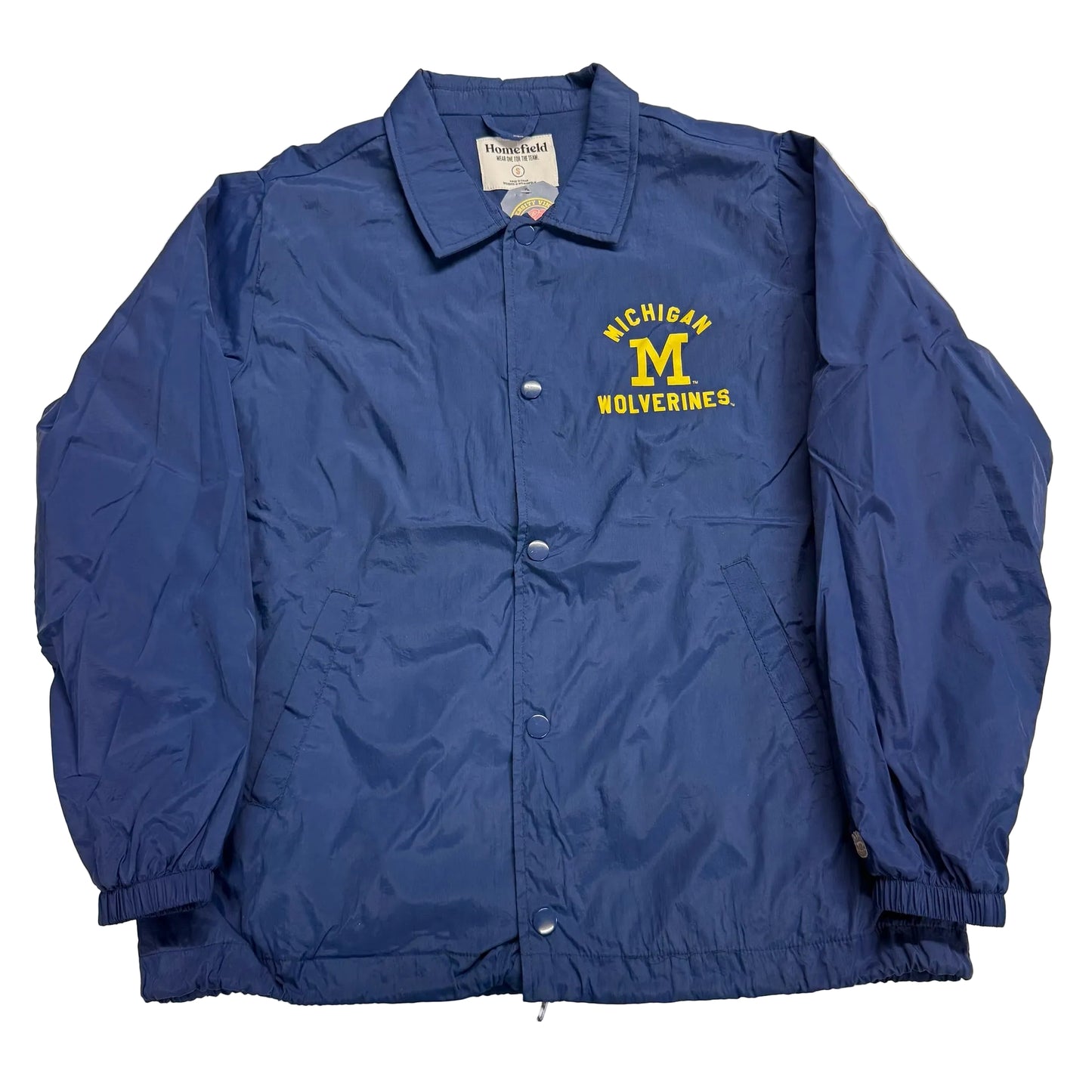 Blue jacket with Michigan Wolverines logo on a light background
