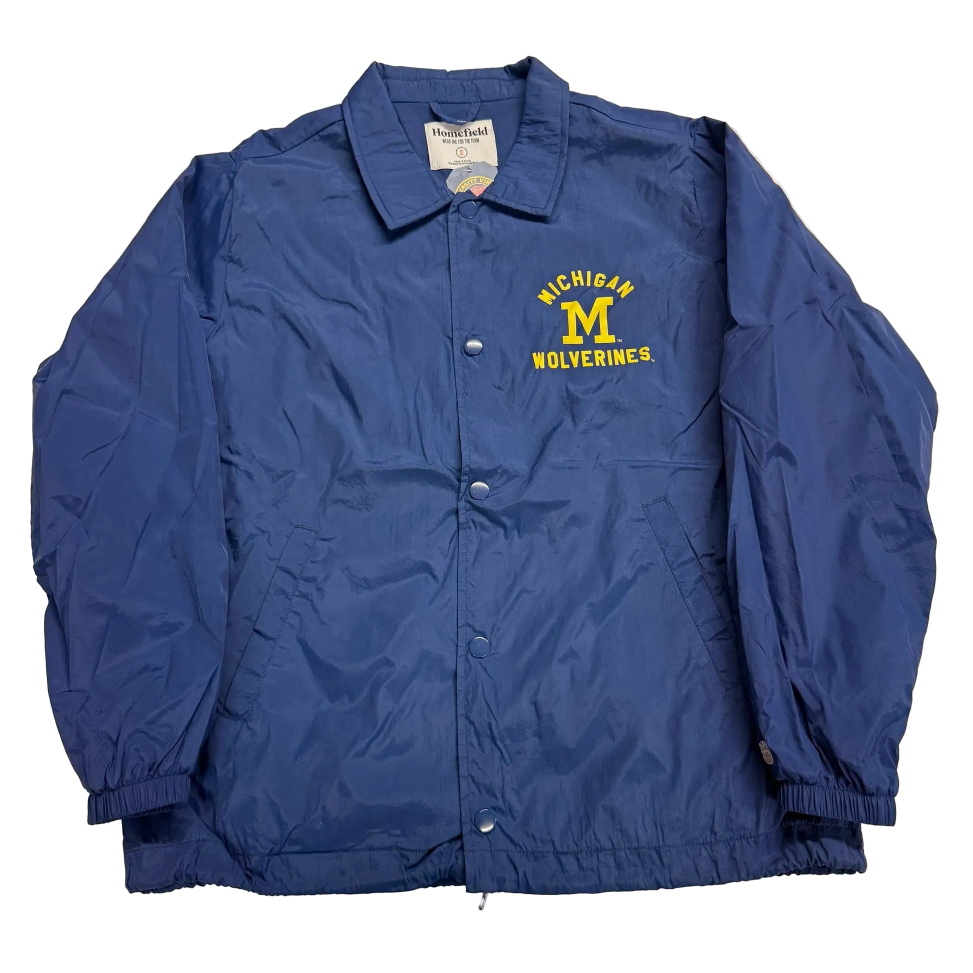 Blue jacket with Michigan Wolverines logo on a light background