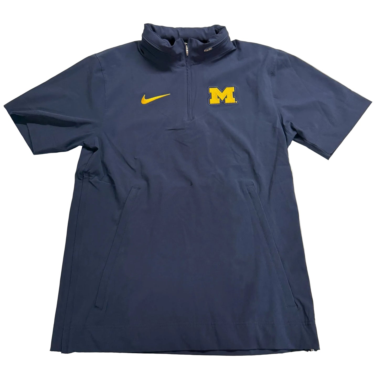 Navy blue quarter-zip shirt with Nike and Michigan logos on a light background