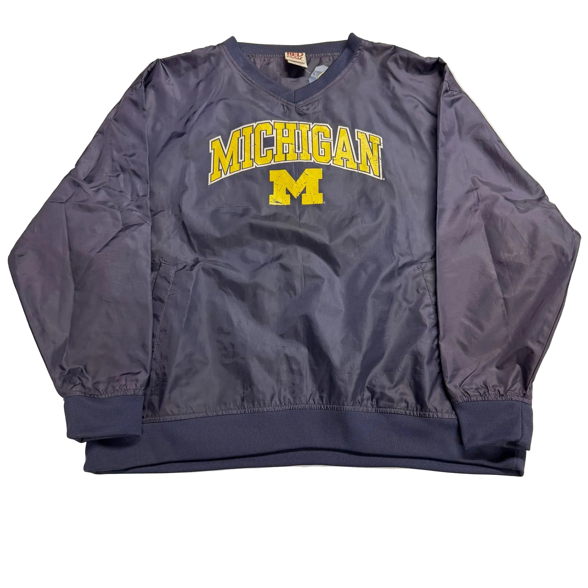 Navy sweatshirt with 'Michigan' printed on it, laid flat on a light-colored surface.