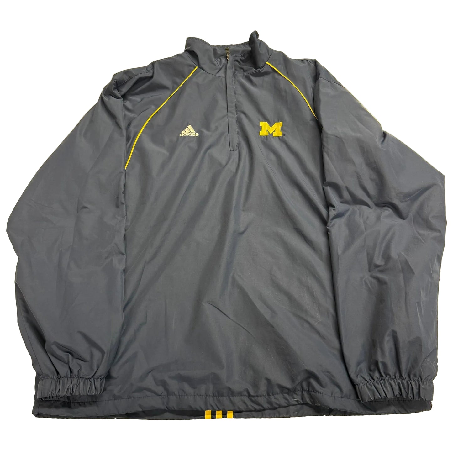 Gray jacket with Adidas logo and Michigan Wolverines letter 'M' on a beige background