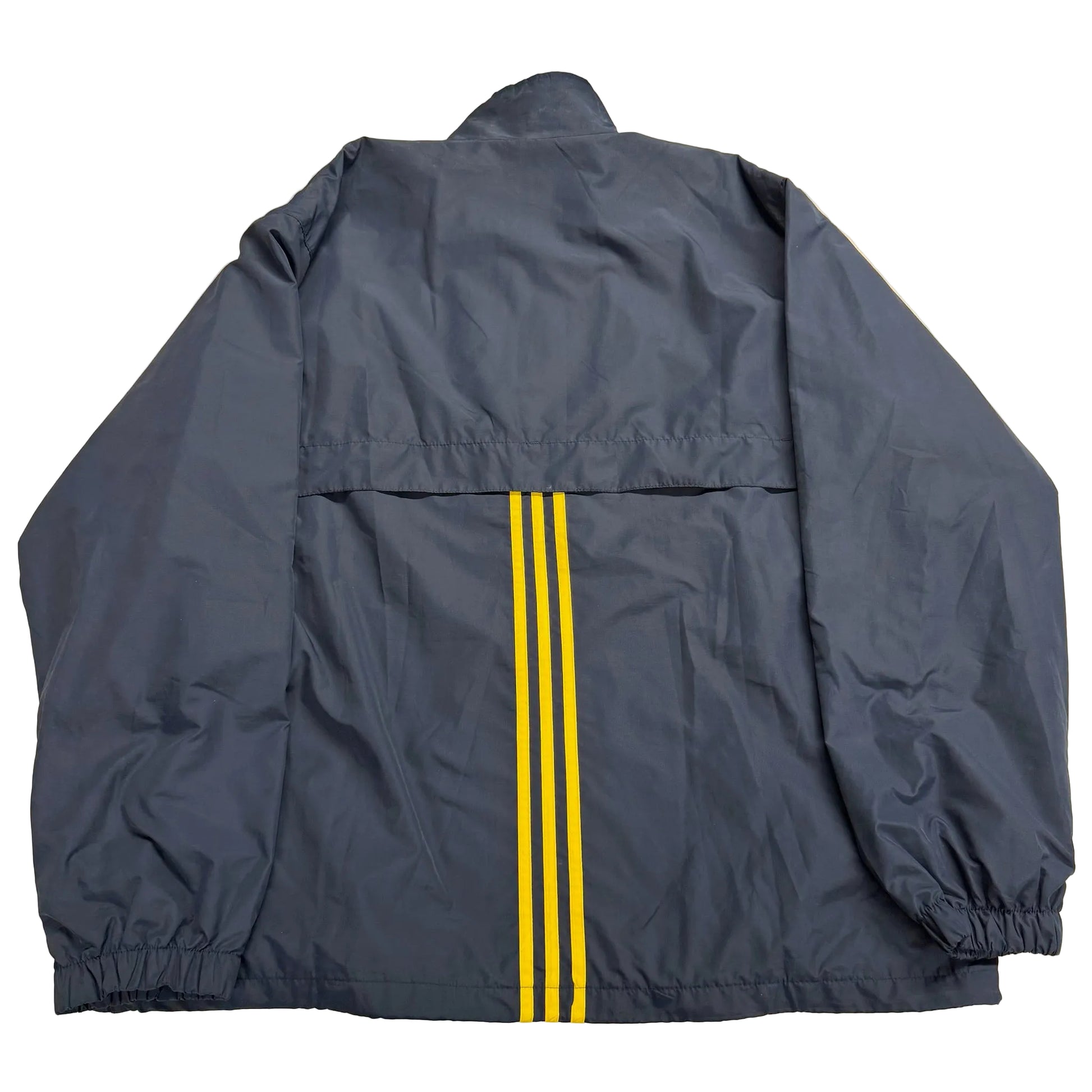 Navy blue jacket with yellow stripes on a beige surface